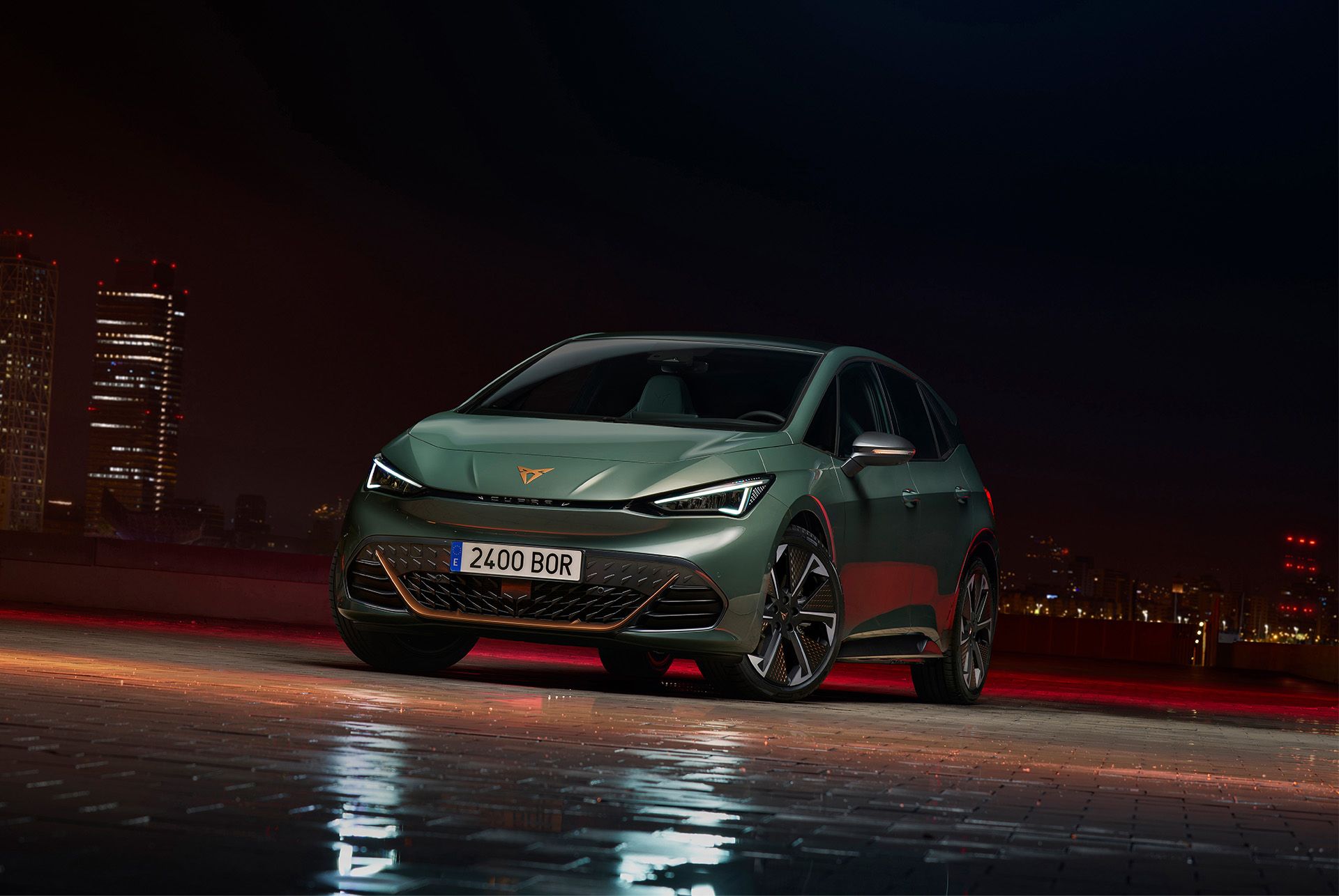 A three quarter front view of the CUPRA Born VZ electric hatchback in Dark Forest green.