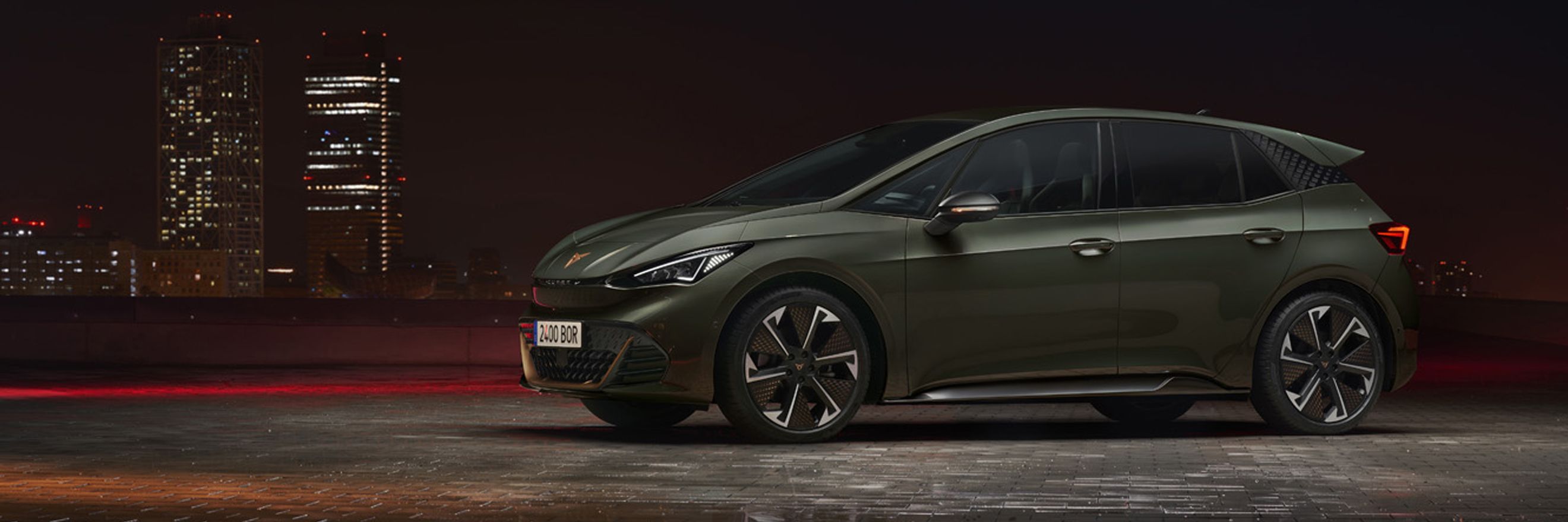 A side view of the CUPRA Born VZ electric hatchback in Dark Forest green.