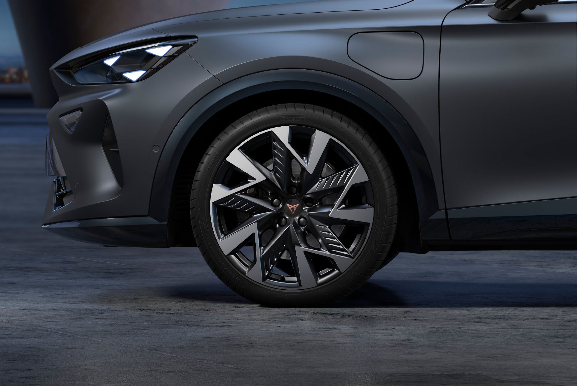 Sandstorm black and silver new CUPRA Formentor alloy car wheels and tyres with logo in the middle.