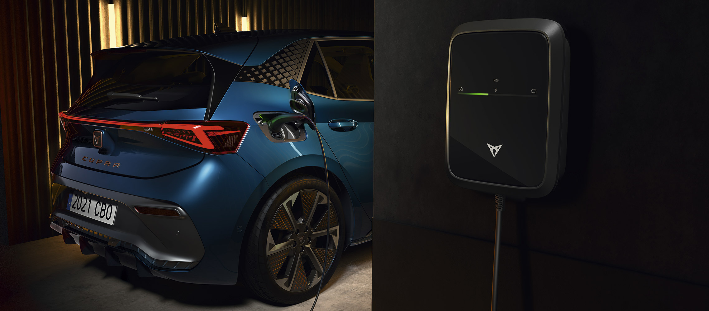 rear of cupra electric car plugged into a wall charger, charging the electric motor