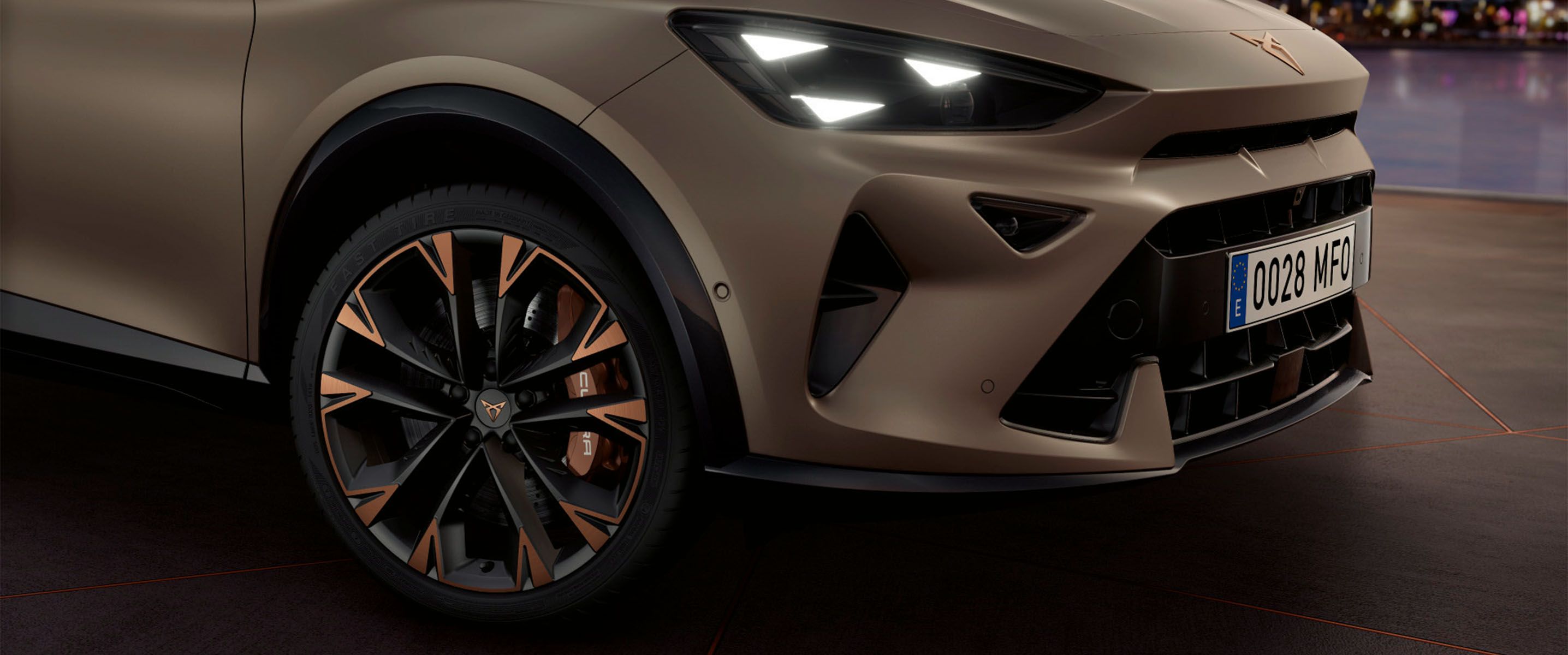 Cupra formentor on the road, close up of copper accent wheels and century bronze mat body. Ota updates for other cupra cars hero